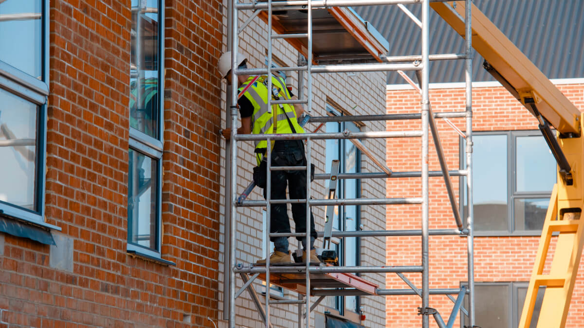 Scaffolder and crane